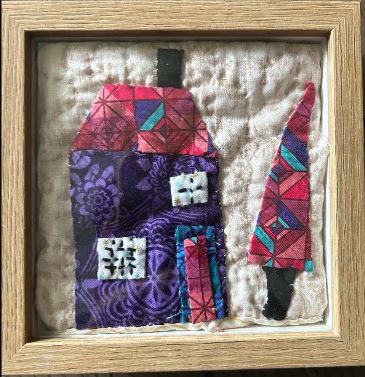 Purple floral house and geometric tree quilted appliqué wall art in natural wood shadow box frame